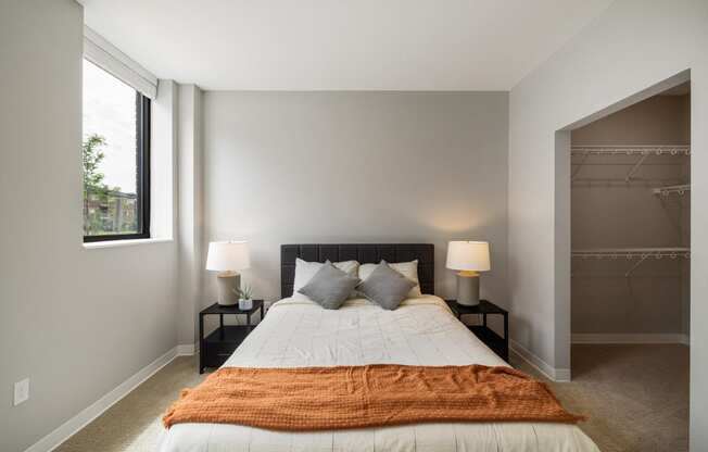 a bedroom with a large bed and a closet at EagleRidge Plaza Residences, Fargo, ND, 58104