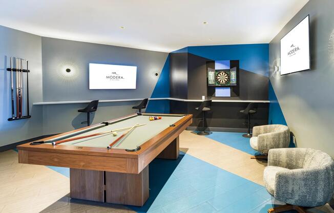 Game lounge with billiards, darts, and lounge seating—your go-to space for casual hangs and spirited competition.