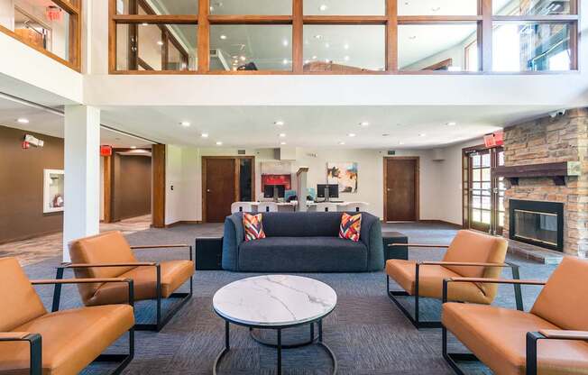 A large room with a fireplace and a couch.