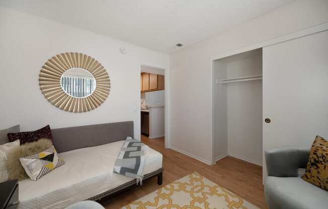 a living room with a couch and a door to a bathroom