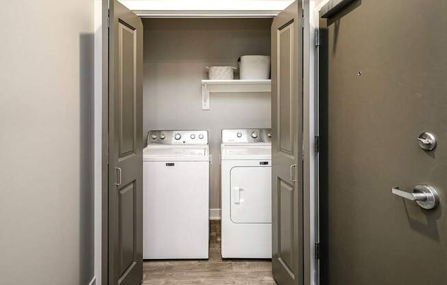 A laundry room with a washer and dryer in it.