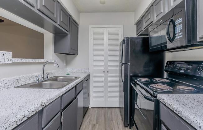 a kitchen with a sink and a window