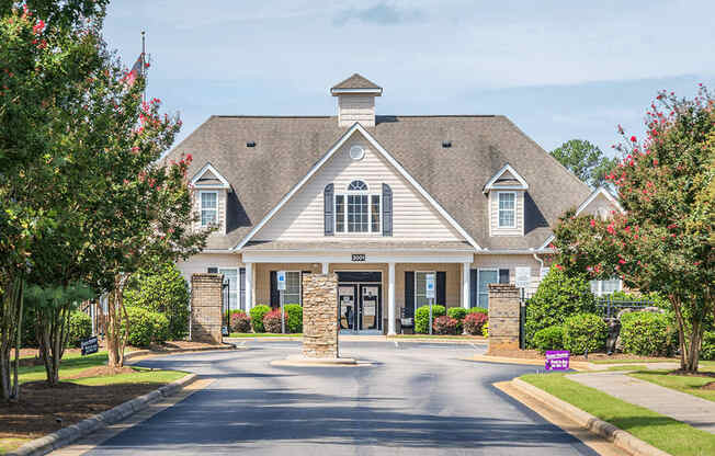 A large house with a driveway in front of it.