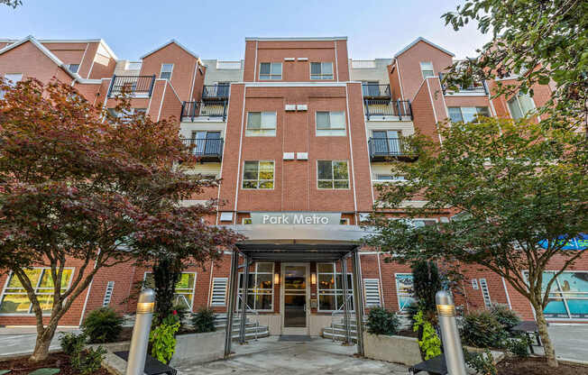 The front of a brick building with the words "Park Metro" on it.