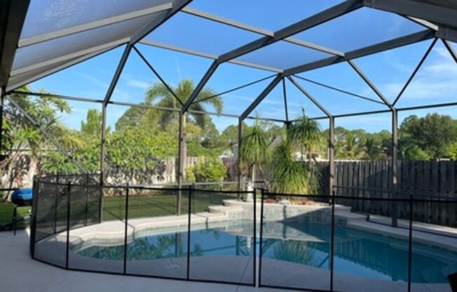 Well maintained large 4/2/2 corner lot pool home on a canal