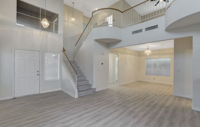 Elegant kitchen open to family room with fireplace.