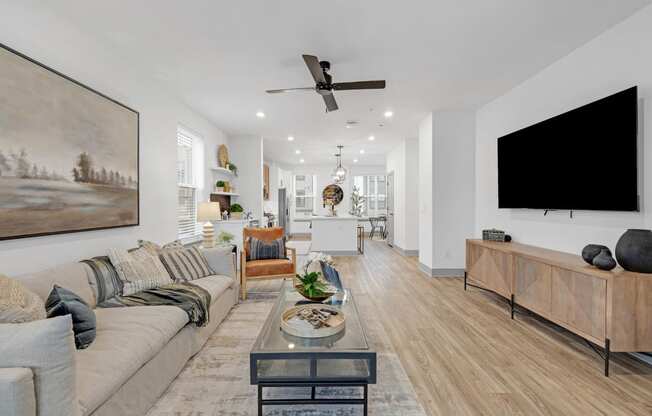 a living room with a couch and a tv at Meridian at CityPlace, Woodbury