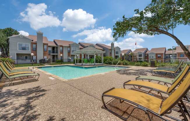 the preserve at ballantyne commons pool with lounge chairs and apartment buildings