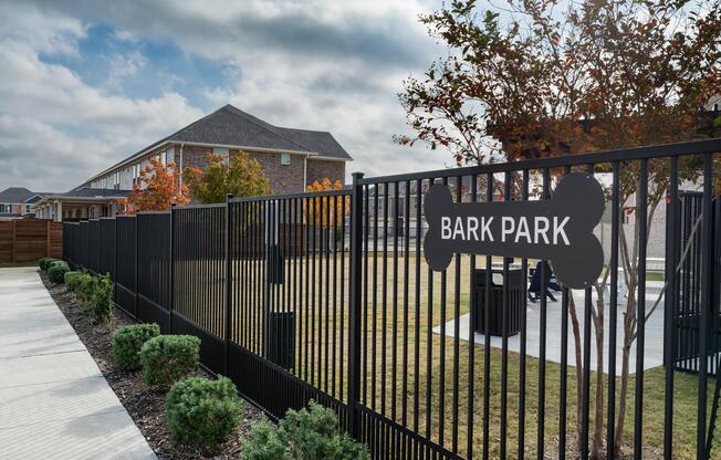 A fenced bark park provides a dedicated space for pets to play, socialize, and enjoy time outdoors close to home.