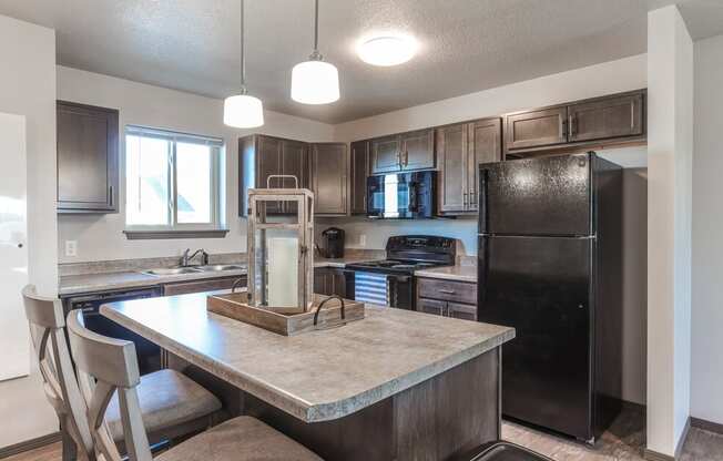 Contemporary open-concept space with large kitchen island.