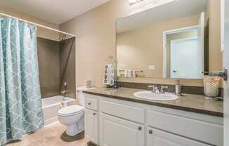 a bathroom with a sink toilet and a shower at Springfield, Renton, 98055 