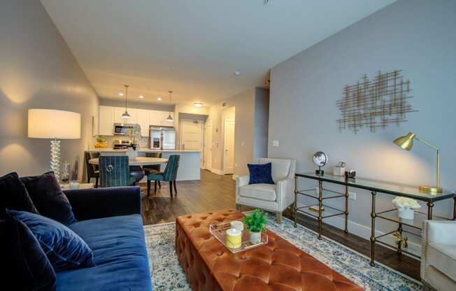 a living room with a couch and a coffee table and a kitchen at Barrington 101, Barrington Illinois