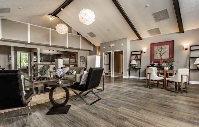 A modern living room with a glass table and chairs