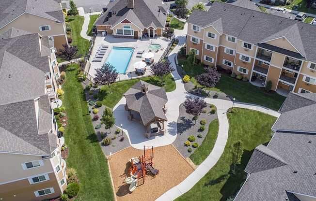 an aerial view of a neighborhood with houses and a swimming pool  at Quail Springs, West Richland, WA
