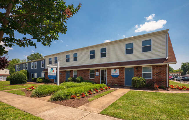 A building with a blue door and a sign on the front.