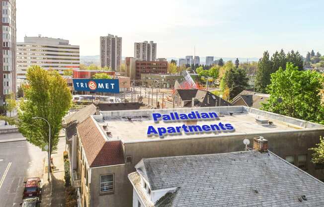 the top of a building with a sign for paladin apartments