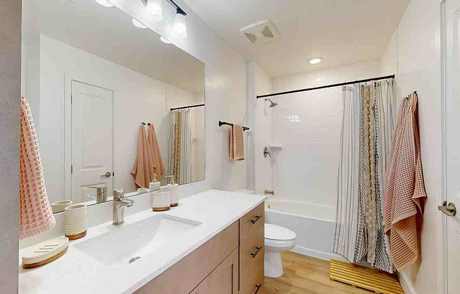 Step into this elegant bathroom oasis featuring contemporary design and soothing light.