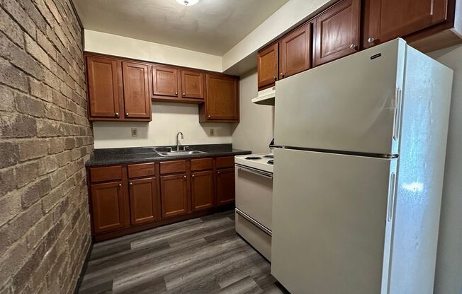 Amazing 1 Bedroom with Beautiful Exposed Brick! Off-Street Parking & Laundry Included!
