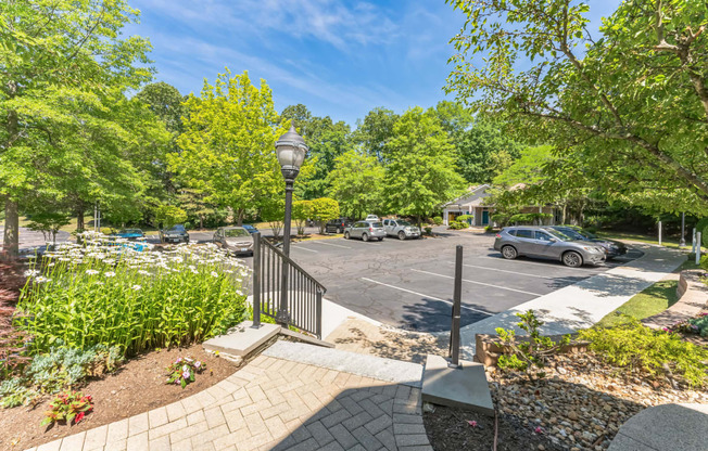 a parking lot with cars in it and trees