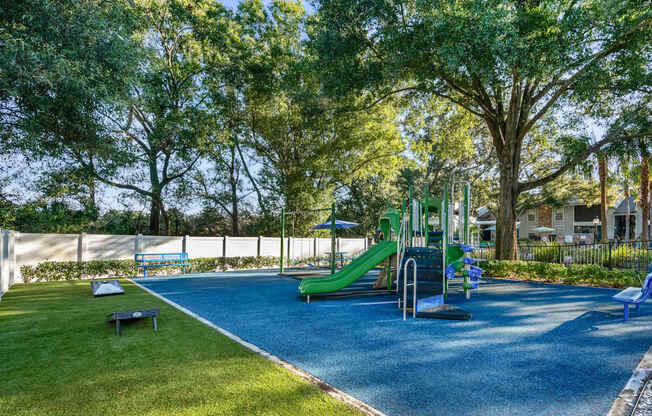 Community playground with composite play top at Grand Pavilion Apartments in Tampa, FL