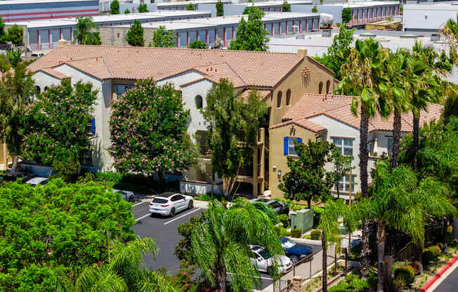A view of a residential area with houses and trees.