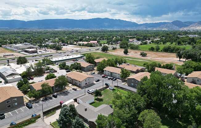 arial view of a city with mountains in the background