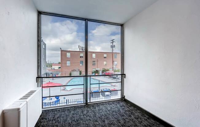 Peak 54 Apartments Hallway with View of Pool in Denver, Colorado