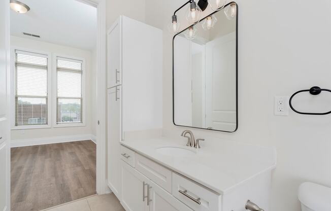 a bathroom with a sink and a mirror