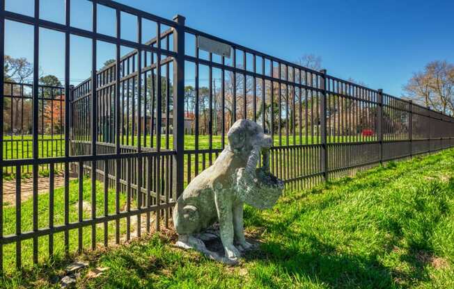 a statue of a statue in front of a fence  at Bayville Apartments, Virginia Beach, 23455