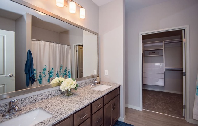 Large Bathroom Vanity with Granite Countertops and Dual Sinks