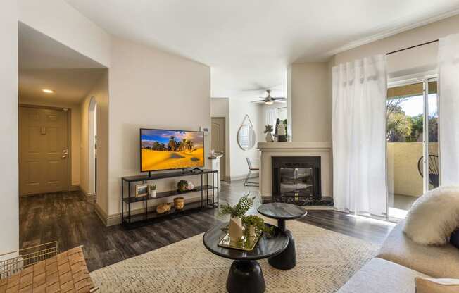 living room with fireplace and tv at Mirasol Apartments, Las Vegas, 89119