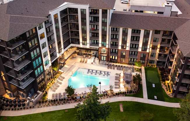 A large building with a pool in the middle of it.