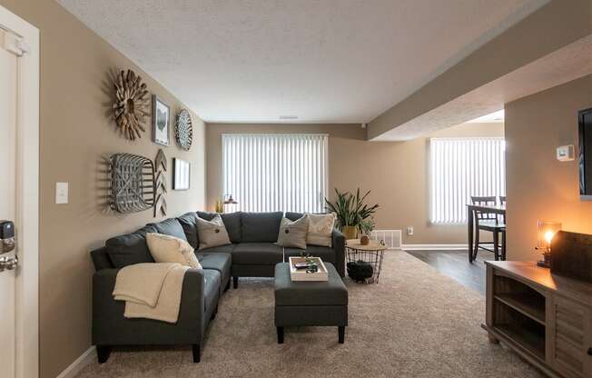 This is a photo of the living room in the upgraded 650 square foot, 1 bedroom, 1 bath model apartment at Deer Hill Apartments in Cincinnati, Ohio.