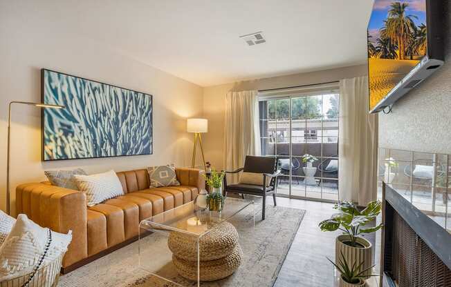 a living room with a couch and a glass coffee table