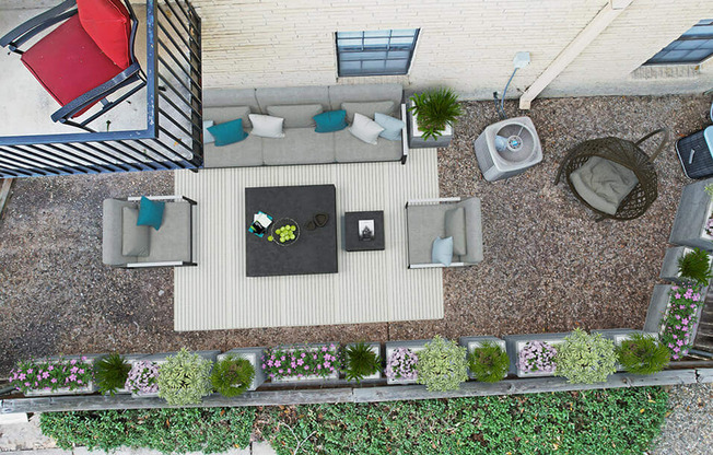 a birds eye view of a patio with furniture and plants