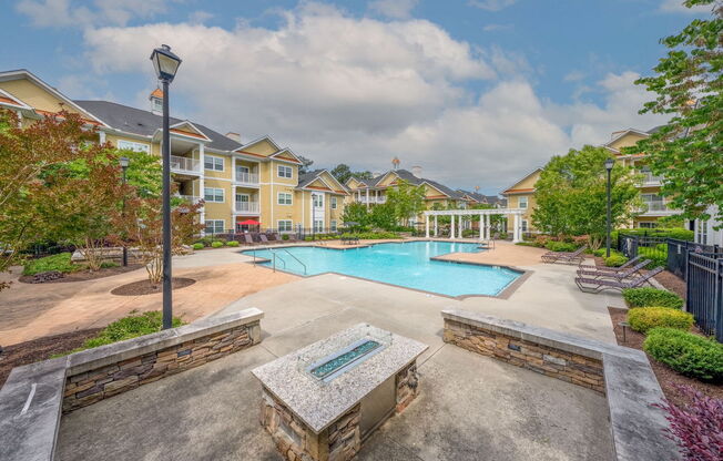 swimming pool and outdoor fireplace at Fenwyck Manor Apartments in Chesapeake, VA