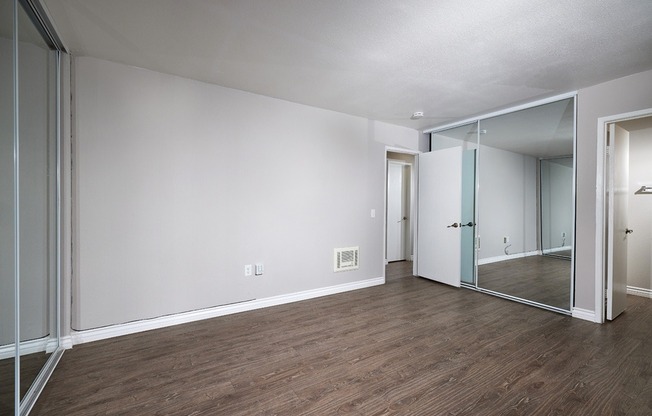 two bedroom bedroom with plank flooring