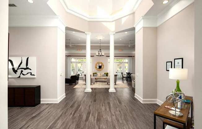 A spacious living room with a wooden floor and a large abstract painting on the left side.