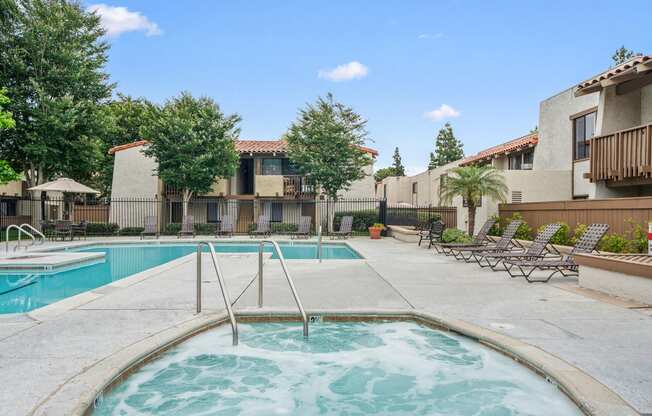 our apartments have a resort style pool and lounge chairs