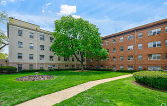 Building exterior with green lawn in Old Town Alexandria, VA.