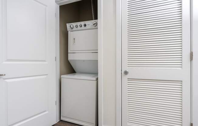 a small laundry room with a washer and dryer