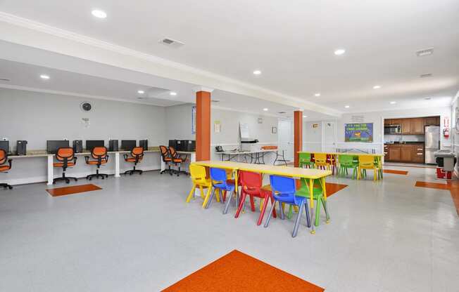 A room with a white floor and a white ceiling with a room full of chairs and tables.