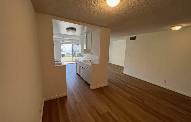 Dining Room with View of Kitchen with White Cabinets