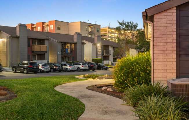 a view of a building with cars parked in a parking lot at South Lamar Village, Texas, 78704