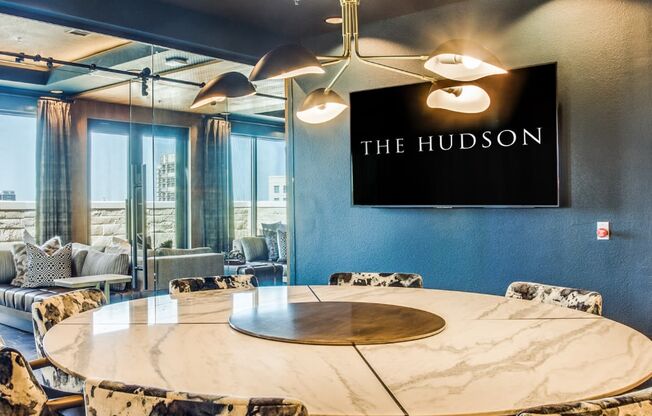 the hudson meeting room with a round table and chairs