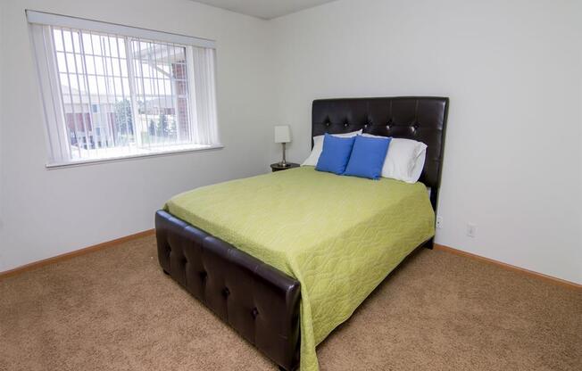 Bedroom with large window in The Northbrook Apartments in Lincoln NE
