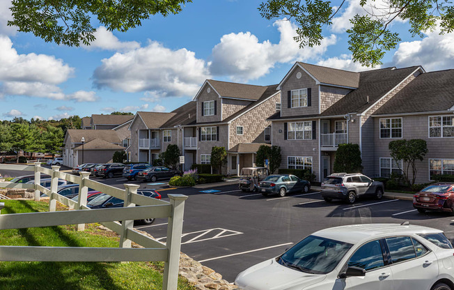 Orchards Apartments Marlborough ma apartment loft style apartments photo of apartment building exteriors with tan siding next to parking lot and landscaping