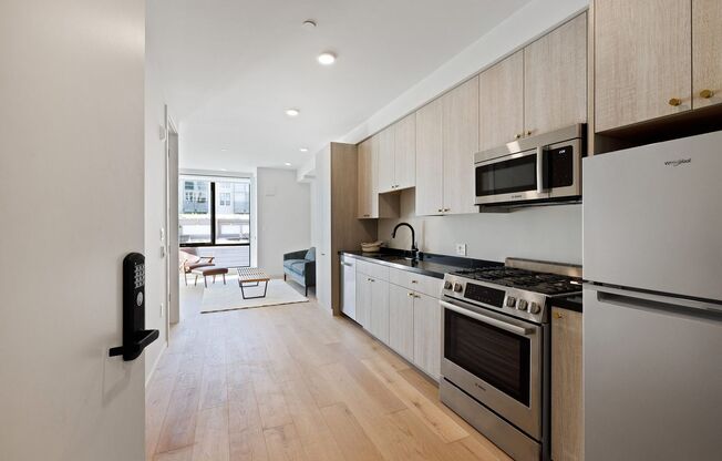 Rare condo available in boutique condo building w/roof deck, elevator, bike parking and storage!