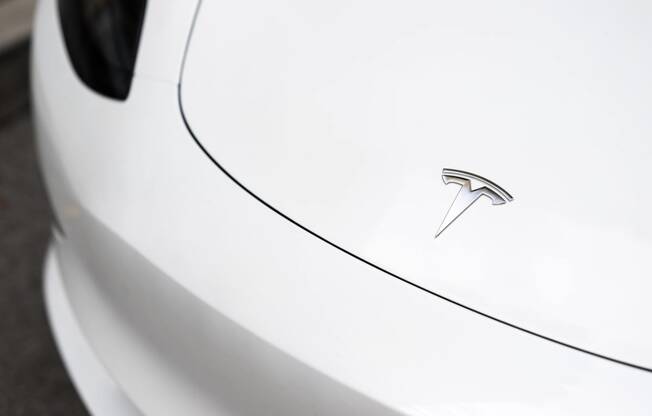 the badge on the side of a white car  at The Belden Stratford, Illinois