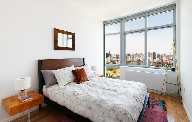 Long Island City studio apartment with high-ceilings and NYC skyline view including the Ed Koch Quee